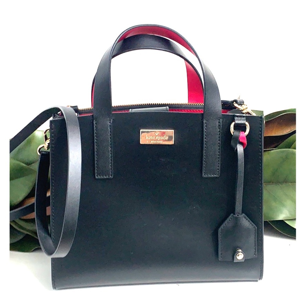 Kate spade black purse with pink inside.